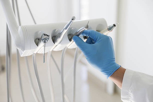 Professional Tooth Extraction technician working in Winston-Salem, NC